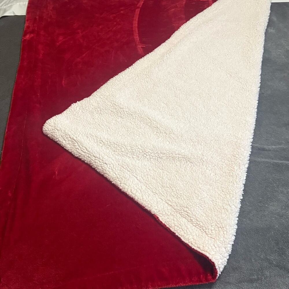 Fleece throw blanket ...beautiful vibrant red on one side and ither cream color